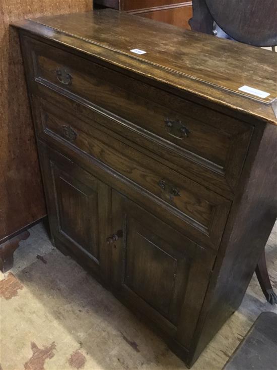 Small panelled oak cabinet